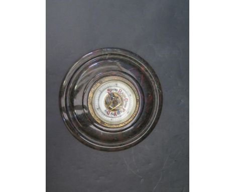 A Serpentine Mounted Aneroid Barometer, 15cm diam. 
