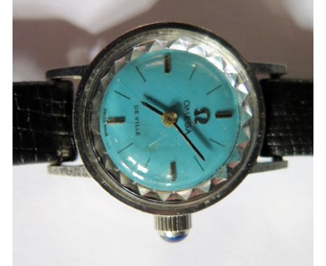 A Ladies OMEGA Wristwatch with blue dial and cabochon sapphire crown, manual Cal. 484 movement, Ref. 511.0426, running
