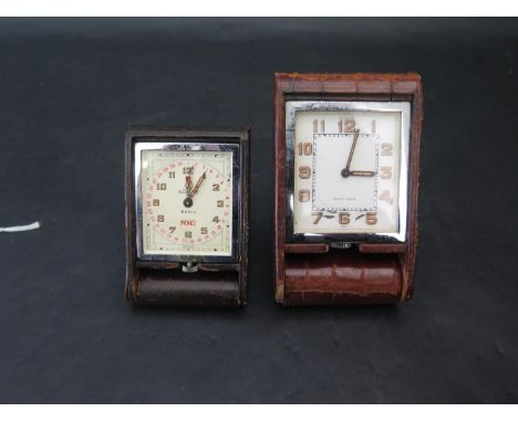 A Le Coultre Travel Clock (A/F) and one other (running) 