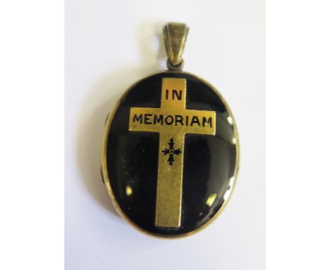 A Victorian 15ct Gold and Enamel Memorial Pendant Locket, fitted with a photograph of a young girl and a lock of hair mounted