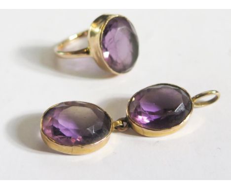A Matching Amethyst Ring and Pendant Set in an unmarked gold setting, ring size N.5 and pendant 45mm, 10g 