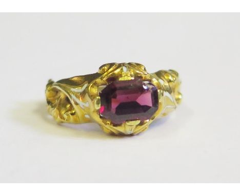 A Georgian Garnet Ring with white foliate enamel shoulders in a high carat intricate foliate mount, size M, 2.2g. Chip to edg