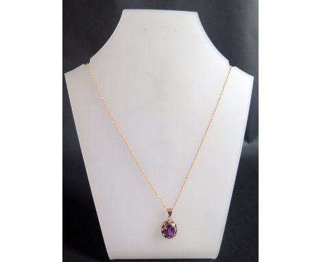 A 9ct Gold Amethyst Pendant (23mm) on 51cm chain, 2.7g 