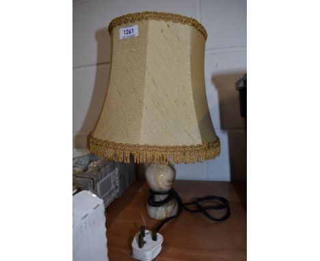 A vintage table top lamp having Onyx stone turned base with original shade