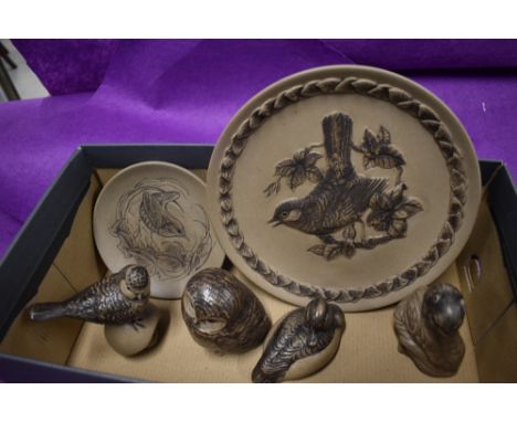 A selection of Poole pottery in a brown glaze including animal studies and plates