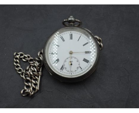 A Continental silver key wound pocket watch having Roman numeral dial with subsidiary seconds on a white enamel face in a sil