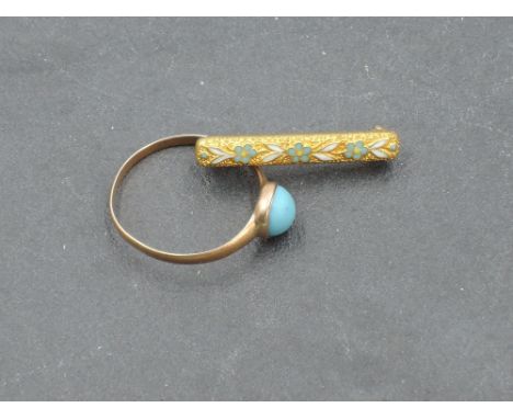 A yellow metal and turquoise children's ring, indistinct mark to shank, size I/J, 0.9grams sold along with a small yellow met