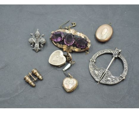 A Pinchbeck and purple stone brooch, a white metal Celtic design annular kilt pin marked 'silver', a white metal fleur de lis