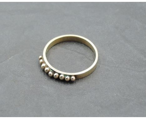 A 9ct rose gold band ring having spherical ball decoration, size Q &amp; approx 2.4g