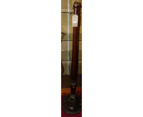 A turned and reeded mahogany standard lamp