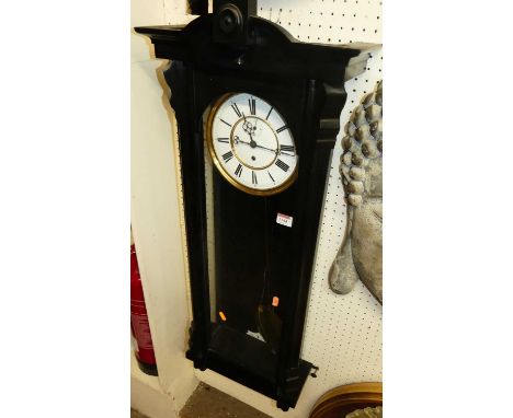 A late 19th century ebonised Vienna drop trunk regulator, with white enamel dial and penulum