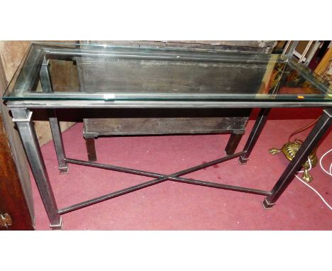 A contemporary steel and heavy glass topped console table, w.122cm