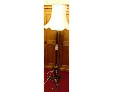 A late Victorian cast brass classical style standard lamp with shadeSome age related marks, otherwise good condition.