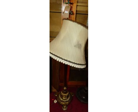 A late Victorian brass standard lamp in the classical taste, with upper three branch light fitting