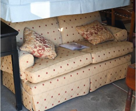 A Multiyork two seater scroll arm sofa, with old gold diamond pattern loose covers c/w two scatter cushions, 170 cm wide x 90