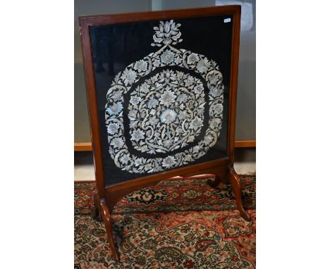 A mahogany framed silk embroidered fire screen 