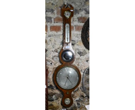 A 19th century mahogany wheel barometer with silvered dial, thermometer, level centred by a convex plate, 97 cm h o/all 