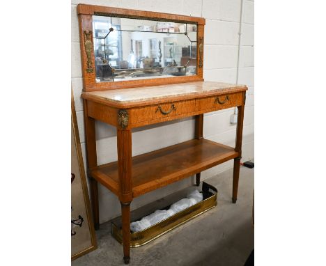 A Continental satinwood marble top console table with mirrored back over two drawers and open shelves, reeded turned supports