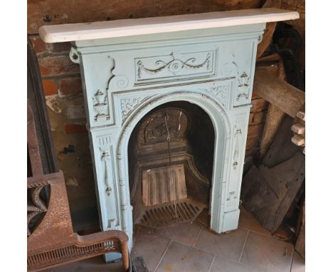 A Victorian cast iron bedroom fireplace, 62 cm wide x 97 cm (with shelf 82 cm wide o/a) 