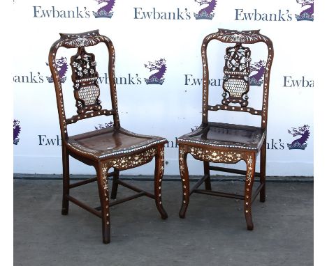 Pair of Chinese mother of pearl inlaid hardwood chairs, the splats in the form of vases of flowers, over panelled seats and c