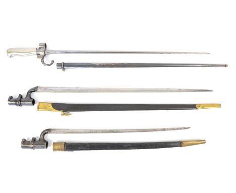 British 1853 pattern socket bayonet with 54cm blade and brass mounted leather scabbard, another with 43cm blade and a French 