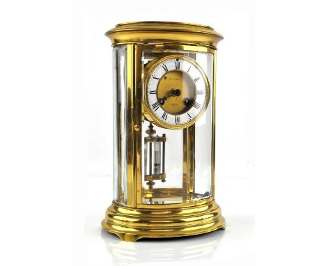 Oval brass four glass mantle clock, the two train movement striking on a bell, mercury compensating pendulum, the dial signed
