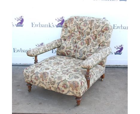 Victorian button back armchair, in the style of Howard & Son, with deep seat and open arms on turned supports, with later bra