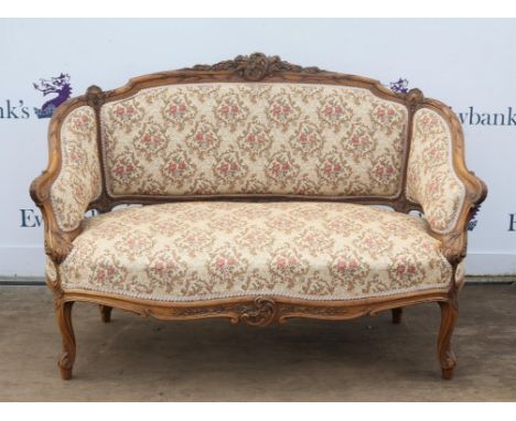 Victorian two seat sofa with carved walnut show frame on cabriole legs and a pair of matching tub chairs