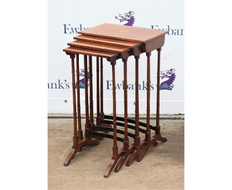 Early 20th century nest of four rosewood tables, each inlaid with a patera on ring turned legs and bracket feet, H74 W46 D30 
