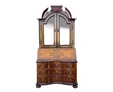 18th century German inlaid walnut bureau bookcase, the broken arched cavetto moulded cornice over a pair of later glazed arch