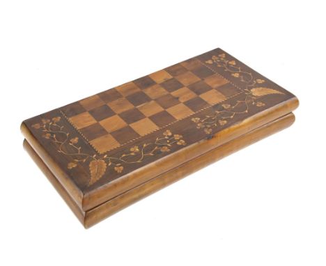 Late 19th century Irish yew wood and Killarney work folding chess and backgammon board, with marquetry inlaid borders, 52.5cm