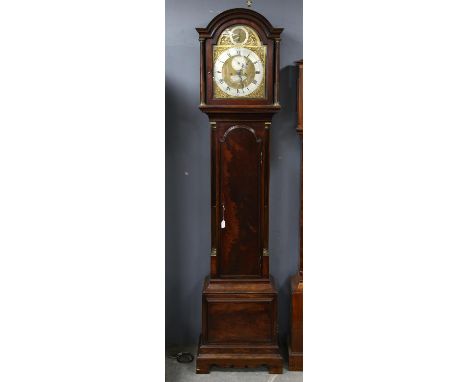 George III mahogany eight day longcase clock, the arched hood, with fluted supports enclosing a brass dial with strike/silent