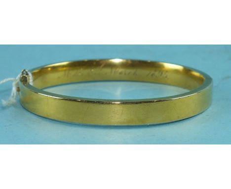 A Victorian unmarked yellow gold hinged bangle, 12.9g.