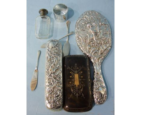 A silver-backed mirror and similar brush, a tortoiseshell cigar case, (a/f), three silver butter knives, a silver napkin ring