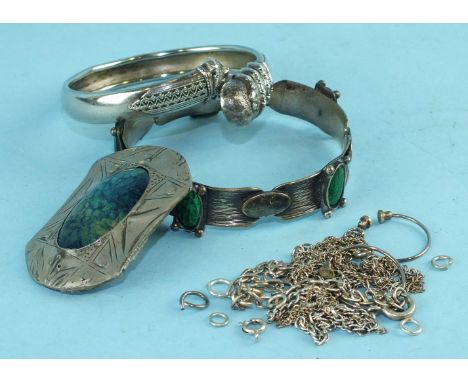 A Ruskin-style enamel and white metal brooch, a plated metal bracelet with green enamel plaques, a white metal snake bracelet
