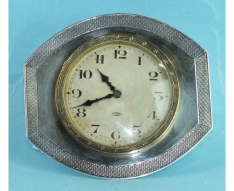 A silver-framed strut clock with engine-turned and plain decoration, fitted with Swiss 8-day movement, 8cm high, 8.5cm wide, 