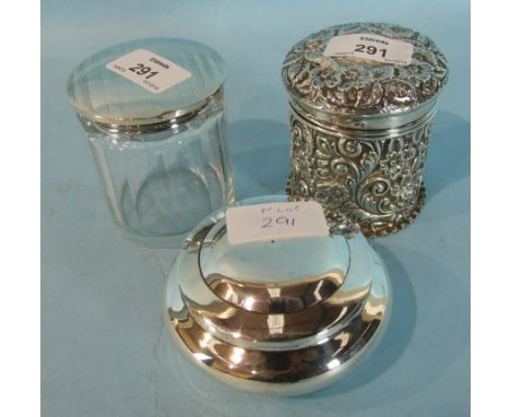 A silver pot and cover, embossed overall with flowers and scrolls, Chester 1898, another pot and cover of bellied form marked