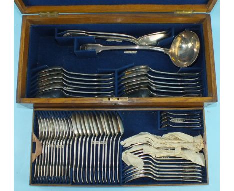 A canteen of Victorian fiddle, thread and shell pattern flatware, London 1861, engraved with a crest, comprising: twelve each