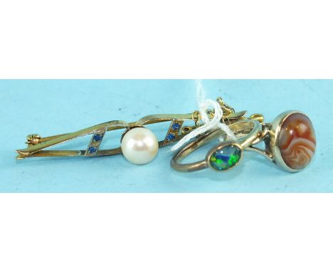 A 9ct gold brooch set pearl, a 9ct gold ring set banded agate, size T½ and another ring set opal doublet, (3).