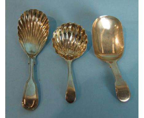 A fiddle and thread caddy spoon with shell bowl, Sheffield 1897, another, marks rubbed and one other fiddle pattern caddy spo