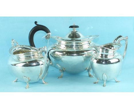 A modern plain oval silver teapot, Sheffield 1935 and a matching sugar basin and cream jug, 1939 (3) ___32.5oz.