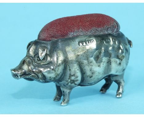 An Edwardian silver novelty pin cushion in the form of a pig, 50mm long, Birmingham 1905.