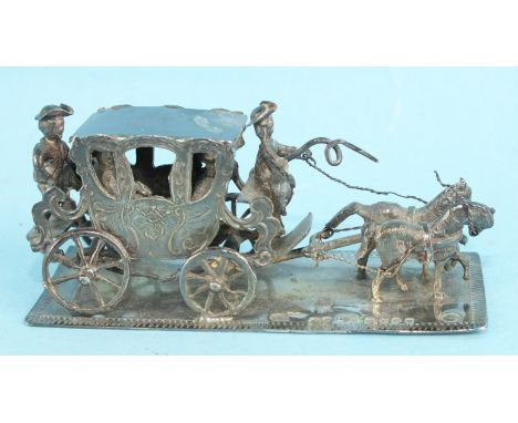 A small Dutch silver model of a stage coach and two horses on rectangular base, 7.1 x 2.8cm, bearing Dutch export marks and h