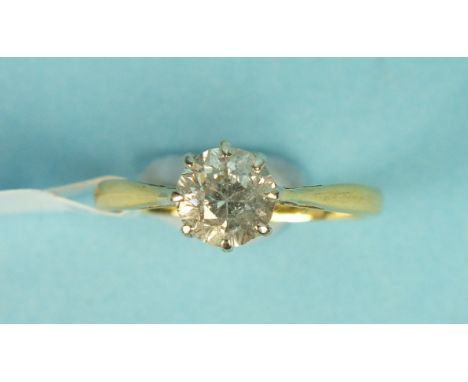 A solitaire diamond ring, claw set an old brilliant cut diamond of approximately .9cts in 18ct gold and platinum mount, size 