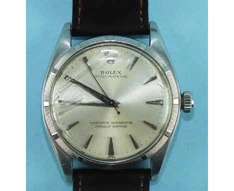 Rolex, a gentleman's Oyster Perpetual steel-cased chronometer wrist watch c1960, with dart numerals and index bezel, the case