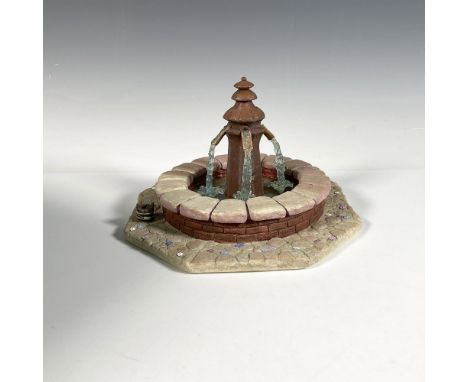 Beauty and the Beast 10th anniversary ceramic fountain with waterfall center and cobblestone rim. Walt Disney Collection back