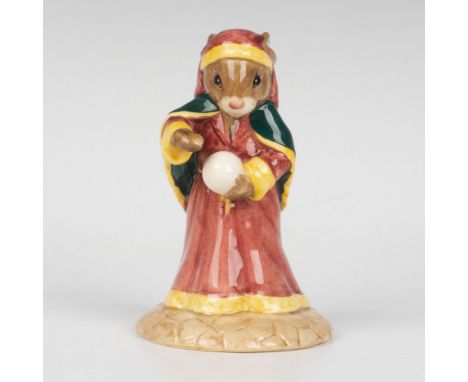 A figure of a psychic, dressed in a flowing pink and yellow dress and green cape, and holding a crystal ball. This item comes