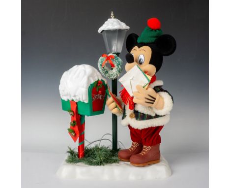 Capture the timeless charm of winter with Mickey donning a cozy coat, scarf, and boots, as he checks his mailbox beside a vin