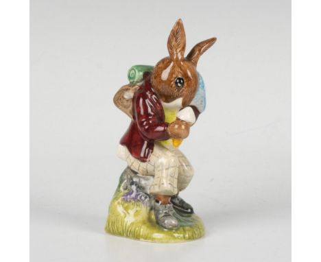 A figure of a bunny, taking a break from the heat by wiping off sweat and enjoying an ice cream. This item comes with its ori