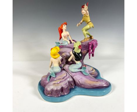 Porcelain figure spinning a story for his audience was originally sculpted for members only. Colored in purple, turquoise, ye
